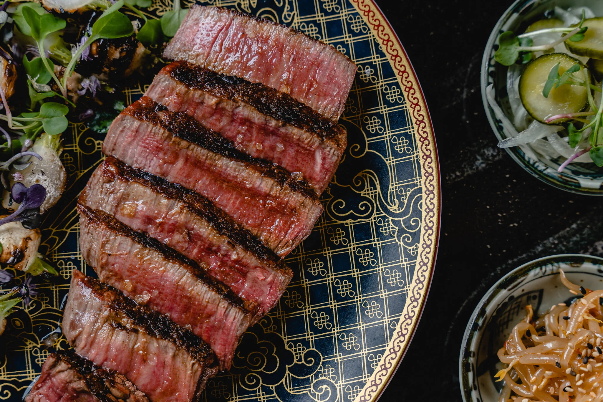 Animae signature dishes Japanese A5 Wagyu, Caviar Shrimp Toast, Tom Yum Mushrooms, Coal-Roasted Cabbage
